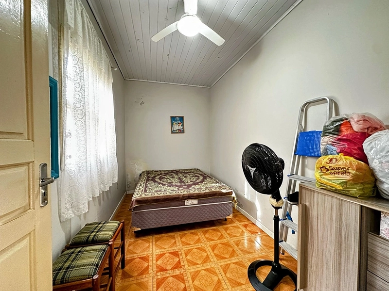 Casa Espaçosa com 3 Dormitórios, Garagem Coberta e Amplo Pátio: 16ª foto da galeria de imagens do imóvel