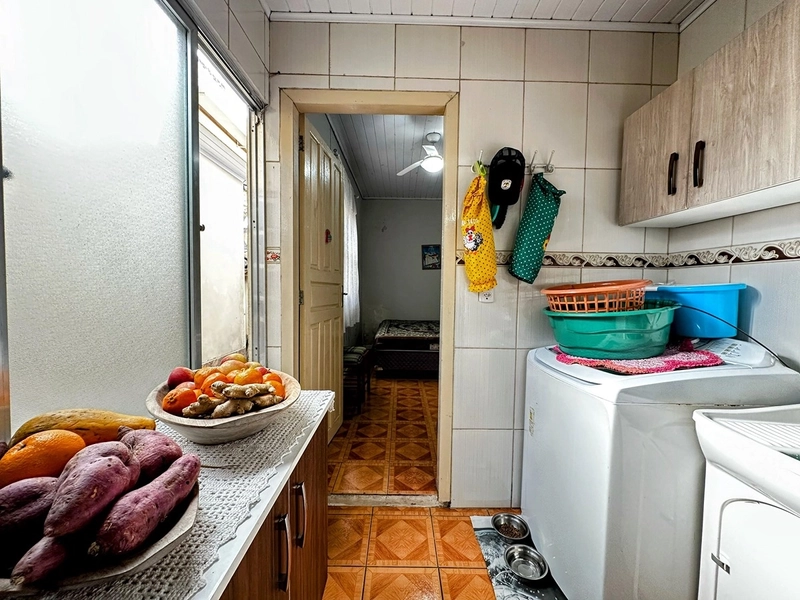 Casa Espaçosa com 3 Dormitórios, Garagem Coberta e Amplo Pátio: 11ª foto da galeria de imagens do imóvel