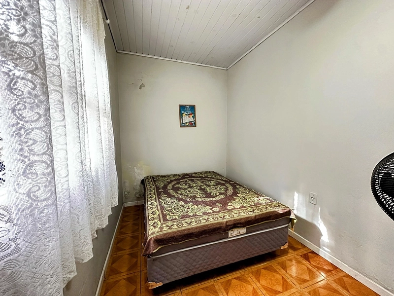 Casa Espaçosa com 3 Dormitórios, Garagem Coberta e Amplo Pátio: 14ª foto da galeria de imagens do imóvel