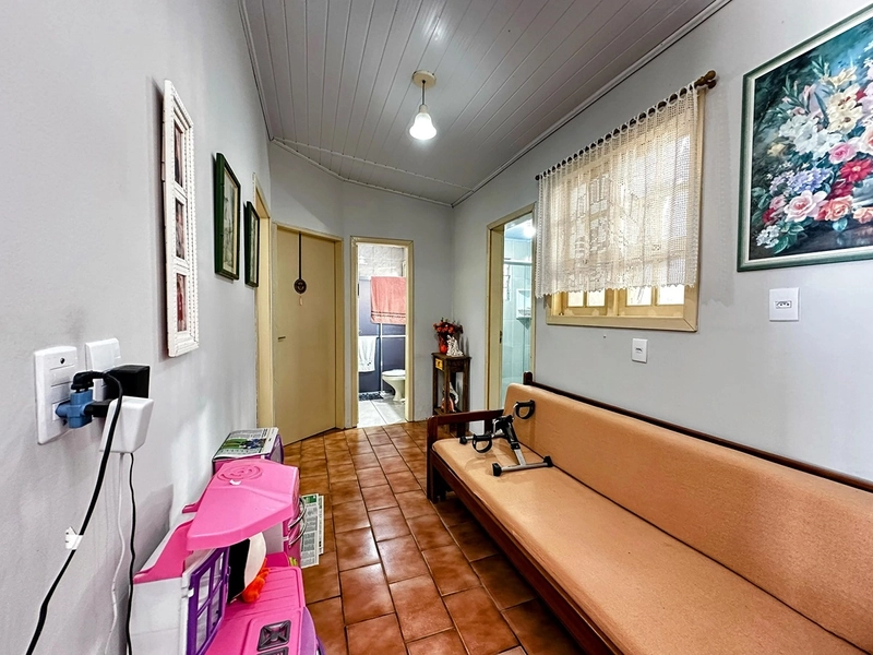 Casa Espaçosa com 3 Dormitórios, Garagem Coberta e Amplo Pátio: 12ª foto da galeria de imagens do imóvel